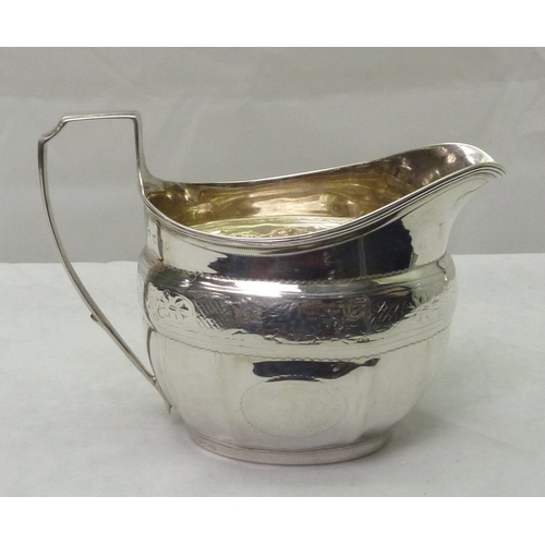 408 - A George III silver cream jug, marks rubbed.  145gr / 142mm long.  A/F bruised