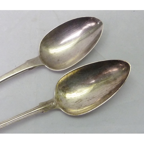 430 - Two silver fiddle pattern table spoons, early 19th cent. 
 The reeded example 223mm long / 140gr.