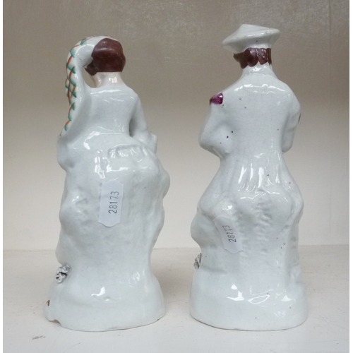 273 - A pair of Staffordshire figures in Scottish dress.