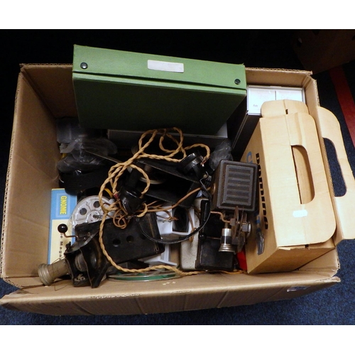 134 - A vintage projector together with slides accessories etc.