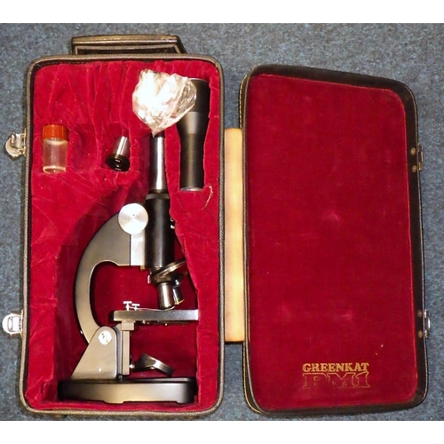 139 - A cased Greenkat PM1 microscope.