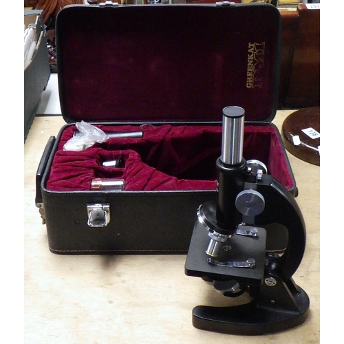 139 - A cased Greenkat PM1 microscope.