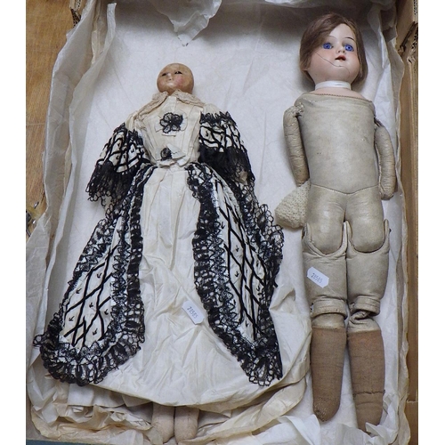 147 - An early doll in 18thC costume together with an Armand Marseille doll with cracked face model 370, b... 