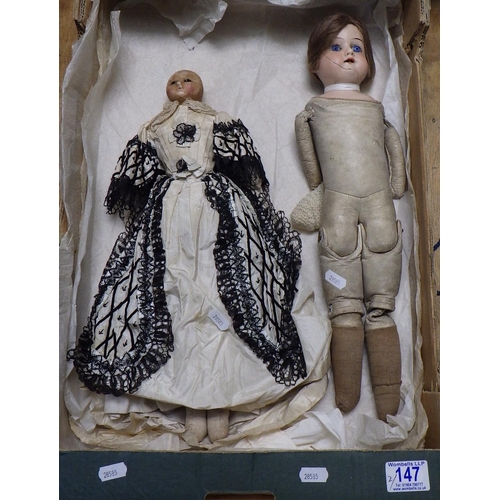 147 - An early doll in 18thC costume together with an Armand Marseille doll with cracked face model 370, b... 