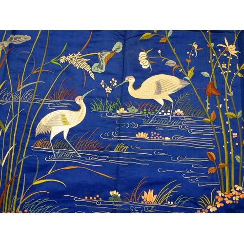 170 - A Oriental blue silk embroidered panel 140cm sq.