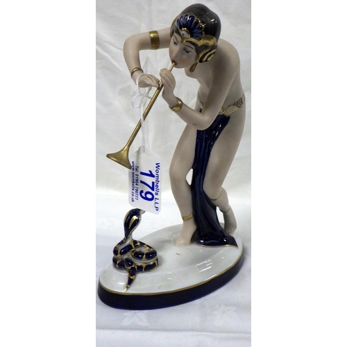 179 - A Royal Dux Snake Charmer, Wooden flute af shortened 24cm tall.
