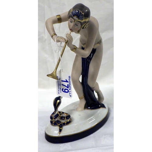 179 - A Royal Dux Snake Charmer, Wooden flute af shortened 24cm tall.
