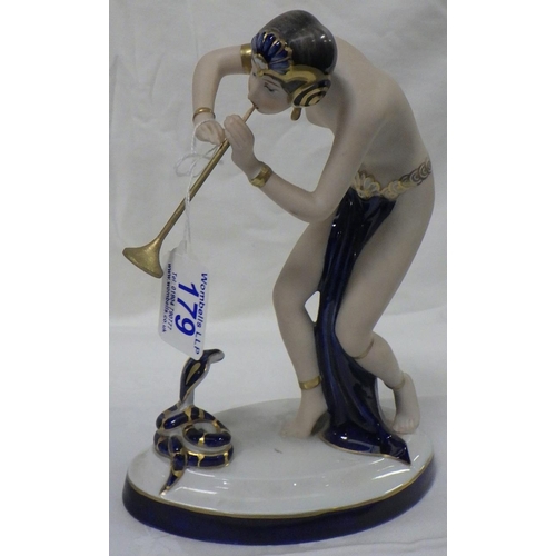 179 - A Royal Dux Snake Charmer, Wooden flute af shortened 24cm tall.