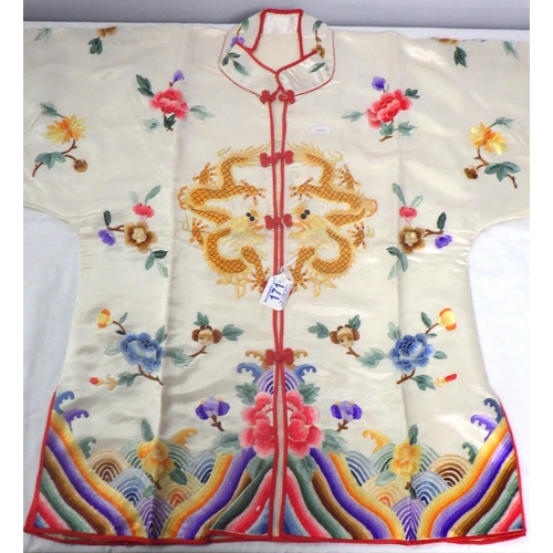 171 - A Oriental silk embroidered jacket together with a silk robe.