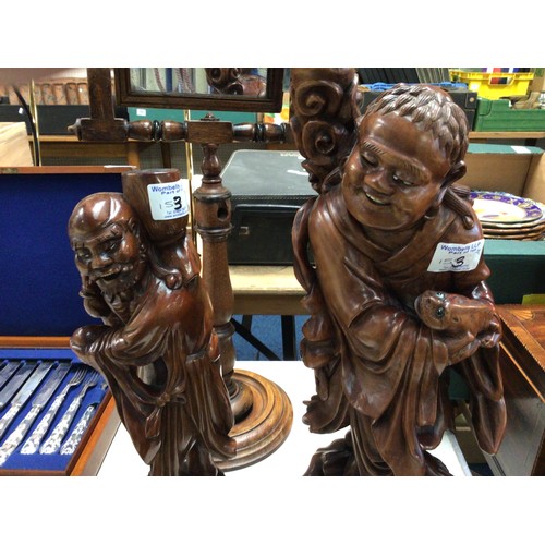 153 - A Chinese carved wood water buffalo together with two similar carved figures and a set of carved ele... 