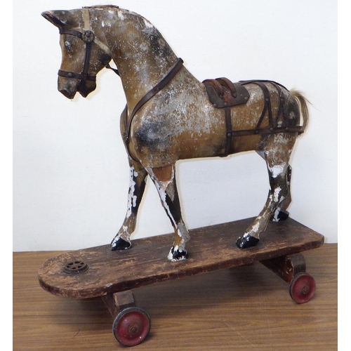 20 - An early children's horse on a skate 61cm tall. Probably skate added later.