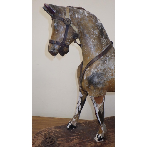 20 - An early children's horse on a skate 61cm tall. Probably skate added later.