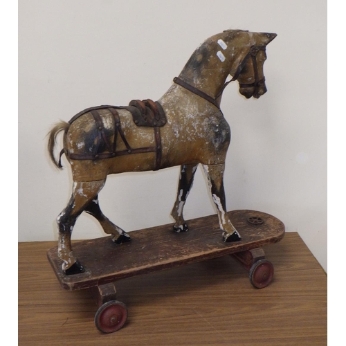 20 - An early children's horse on a skate 61cm tall. Probably skate added later.