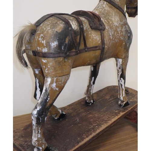 20 - An early children's horse on a skate 61cm tall. Probably skate added later.