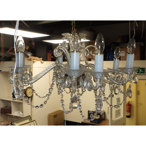 58 - An eight arm chandelier with chain af.