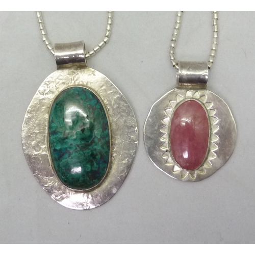 361 - Two pendants, white metal marked 999 set with polished specimen stones, both suspended on white meta... 