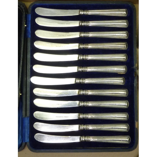 369 - A cased set of 12 silver handled butter knives; silver incl a pair of hair brushes; a toast rack; a ... 