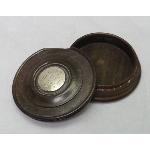 370 - A snuff or trinket box, turned oak inset with central white metal roundel engraved 