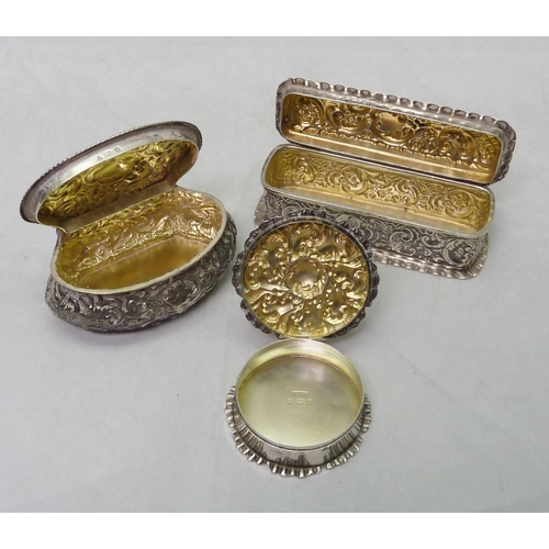 371 - Three silver trinket boxes, c1900, the basket shaped example 80 x 47mm.  120gr gross.