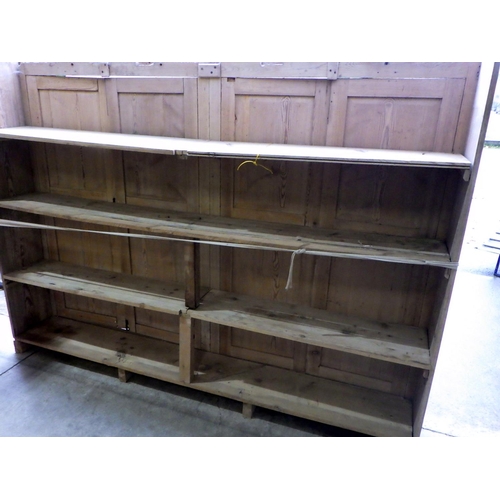 658 - A large four door pine cupboard, a/f warped, missing back and other parts, 256cm long, ex Nun Applet... 