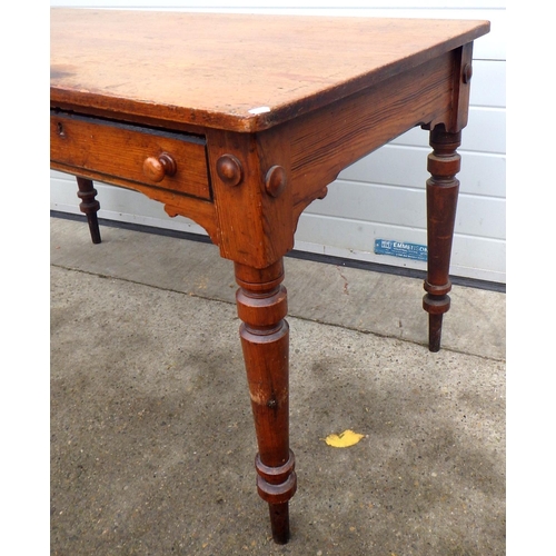 686 - A Victorian pitch pine writing table/ washstand, on turned  legs, 138cm wide, marks