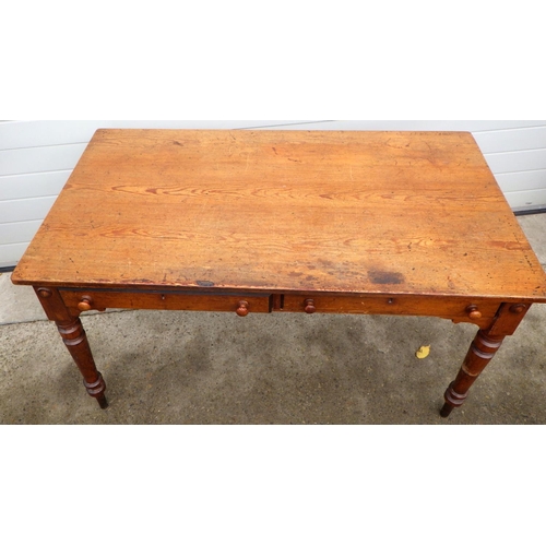 686 - A Victorian pitch pine writing table/ washstand, on turned  legs, 138cm wide, marks