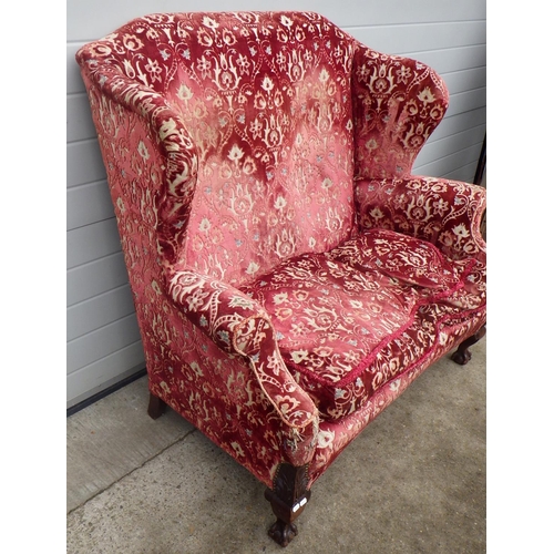 701 - An Edwardian wingback settee on ball & claw cabriole legs, approx 130cm across, a/f loose