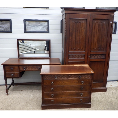 711 - A J.C linenfold panelled oak bedroom suite, incl, wardrobe, chest, & dressing table (3)