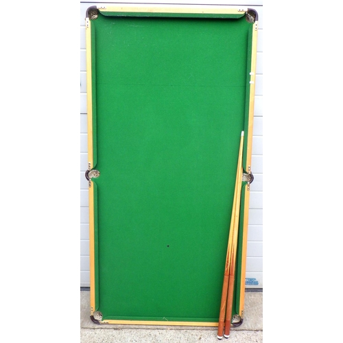 719 - A table top snooker table, with cues