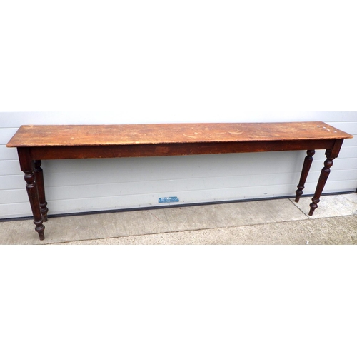 722 - A Victorian long, narrow side table on turned legs, 244cm long, 41cm deep