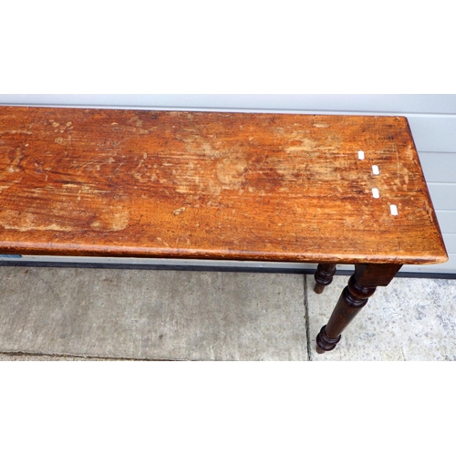 722 - A Victorian long, narrow side table on turned legs, 244cm long, 41cm deep