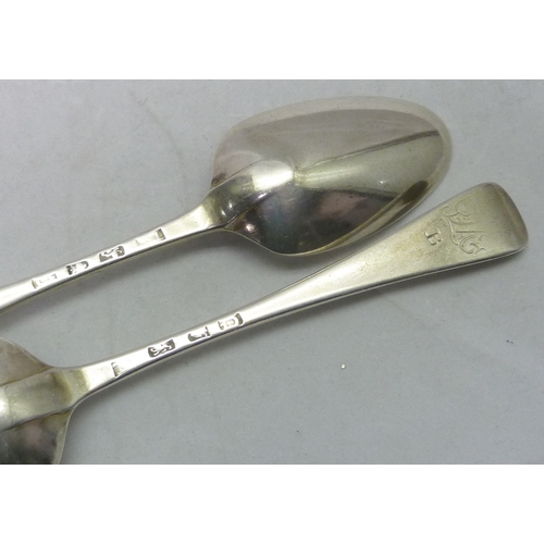 411 - A pair of George II silver hanoverian pattern table spoons, London 1759, 209mm long; two similar sin... 