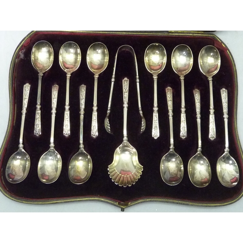 416 - A Victorian silver cased set of twelve silver teaspoons together with matching sugar tongs and caddy... 