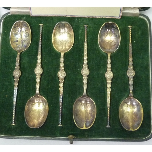 417 - A cased set of six silver model anointing spoon teaspoons, 20th cent; a cased set of six silver 1937... 