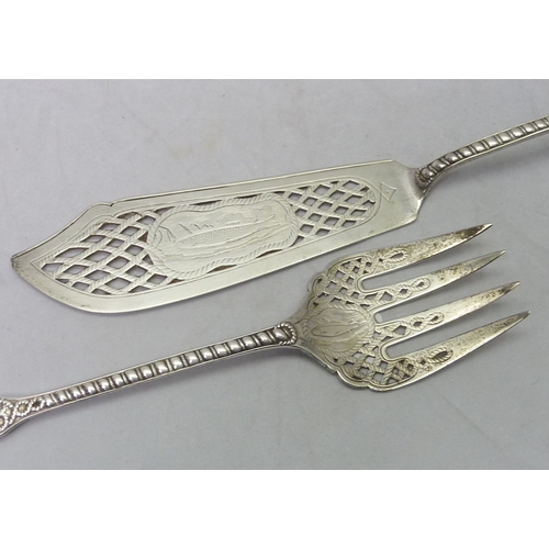 421 - A Victorian silver fish server set, London 1866.  Slice 315mm long / 290gr.