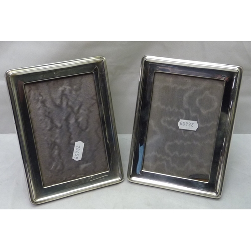 422 - A pair of rectangular silver photograph frames, 130 x 85mm aperture; another modern rectangular fram... 