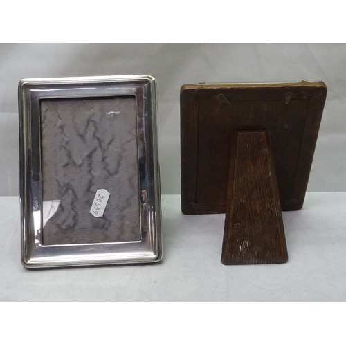 422 - A pair of rectangular silver photograph frames, 130 x 85mm aperture; another modern rectangular fram... 