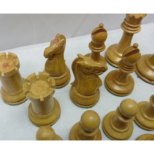 426 - A cased set of carved wood Staunton pattern chessmen by Jaques & Son, London.