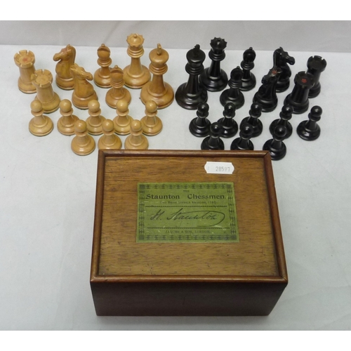 426 - A cased set of carved wood Staunton pattern chessmen by Jaques & Son, London.