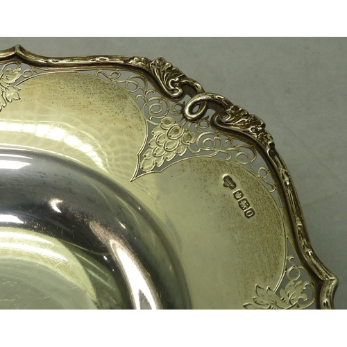 556 - A silver pedestal bowl having applied and pierced decoration, 20th cent, 228mm across diagonal; a Vi... 