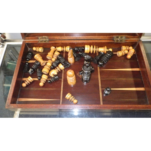 555 - A 19thC St George pattern box wood and ebony chess / back gammon set