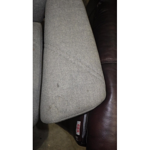 860 - A stressless grey chair and stool af stained.