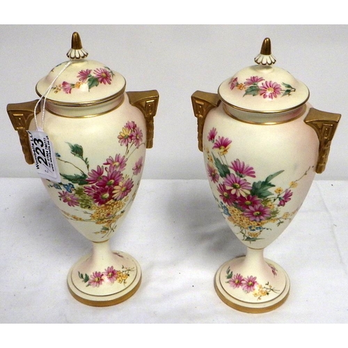 223 - A pair of Royal Worcester Ivory Blush Golden Bouquet Limited Edition of 200 no:117 lidded urns 26cm ... 