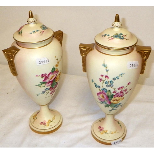223 - A pair of Royal Worcester Ivory Blush Golden Bouquet Limited Edition of 200 no:117 lidded urns 26cm ... 