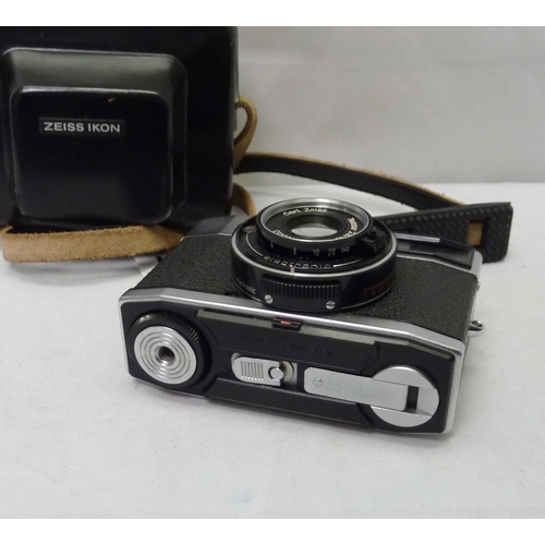 4 - A Zeiss Ikon S310 35mm compact camera in black leather ever-ready case.