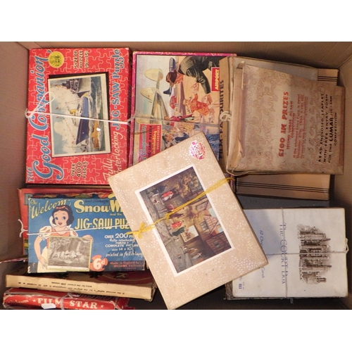 50 - Two boxes of various vintage jigsaw, af play worn (2)