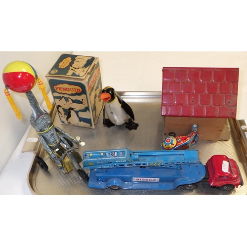 56 - A Radio Rex vintage toy together with misc Japanese Tin clockwork toys and a boxed wind-up rock and ... 