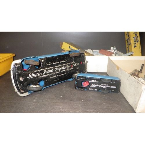 83 - Two Schuco clockwork cars together with Tri-Ang ships etc