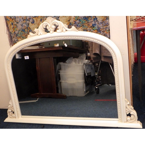 A cream painted over mantle mirror