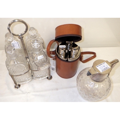 104 - A Silver plated four decanter holder together with a plated  jug (repairs) and a three bottle picnic... 